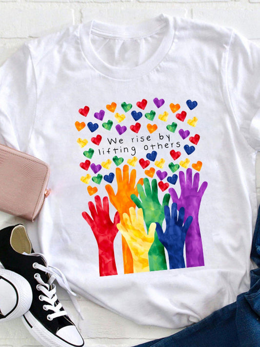 Women's Graphic T-Shirt We Rise By Lifting Others Colorful Hearts And Rainbow Hands