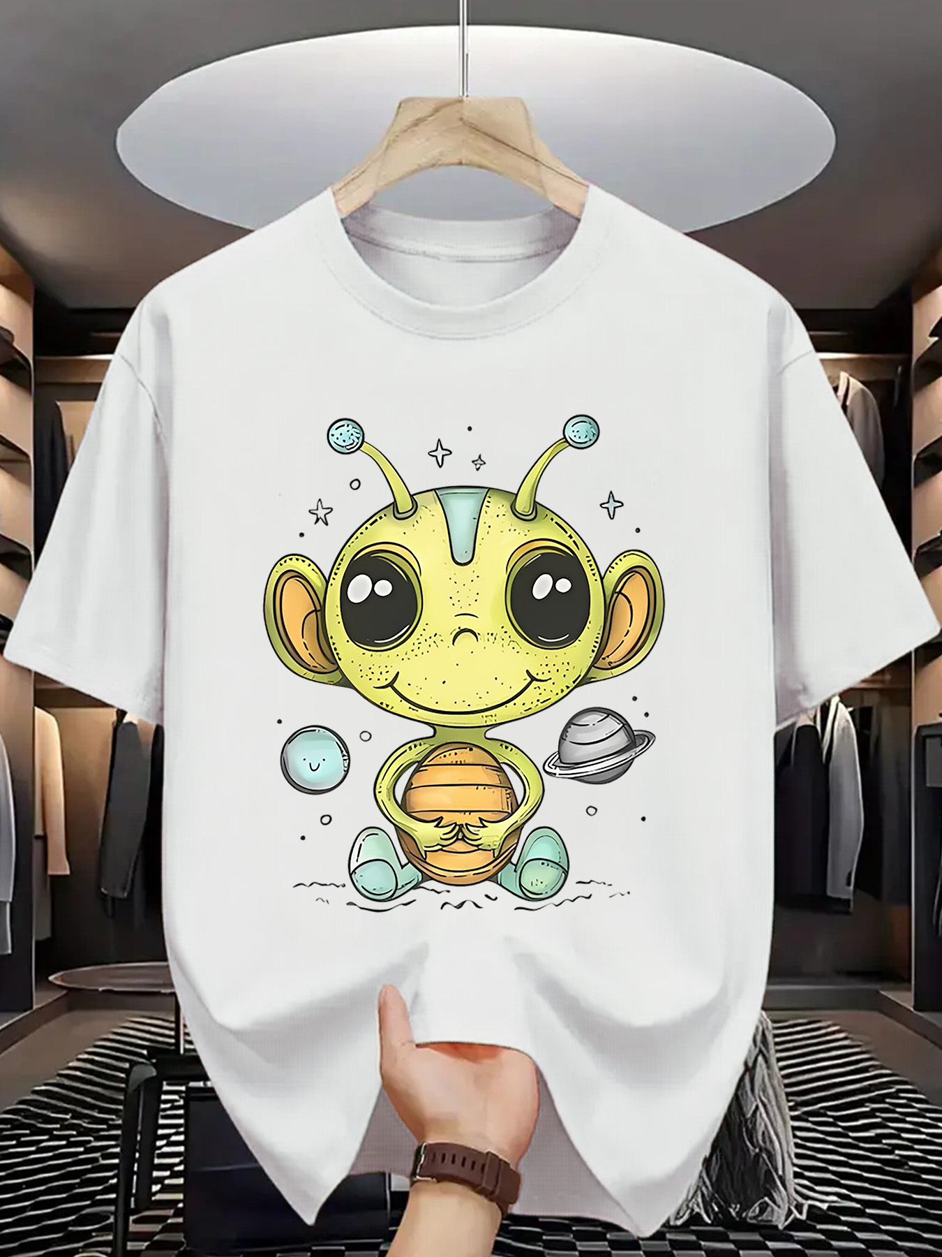 Men's Graphic T-Shirt Playful Cartoon Alien With Stars Among Floating Planets Spacesuit Creature