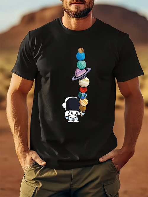 Men's Graphic T-Shirt Playful Astronaut Holding Whimsical Planets Under Starlit Night Sky Ice Cream Cone