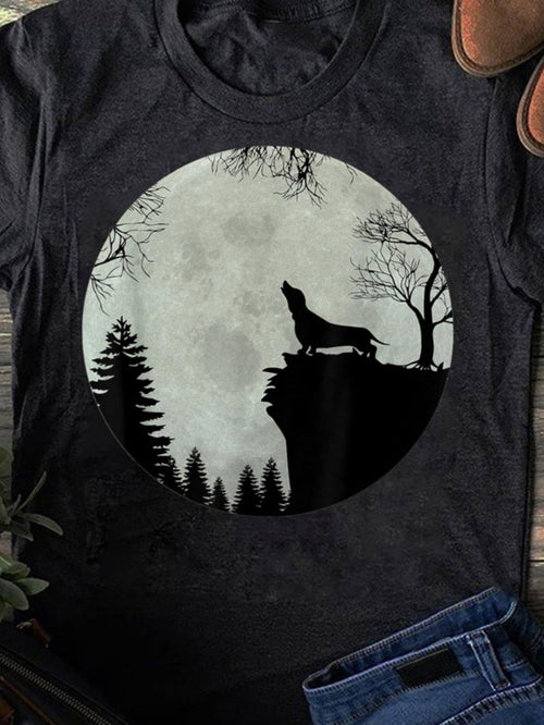 Men's Graphic T-Shirt Howling Wolf Silhouetted Under Full Moon With Pine Trees And Cliffside Forest