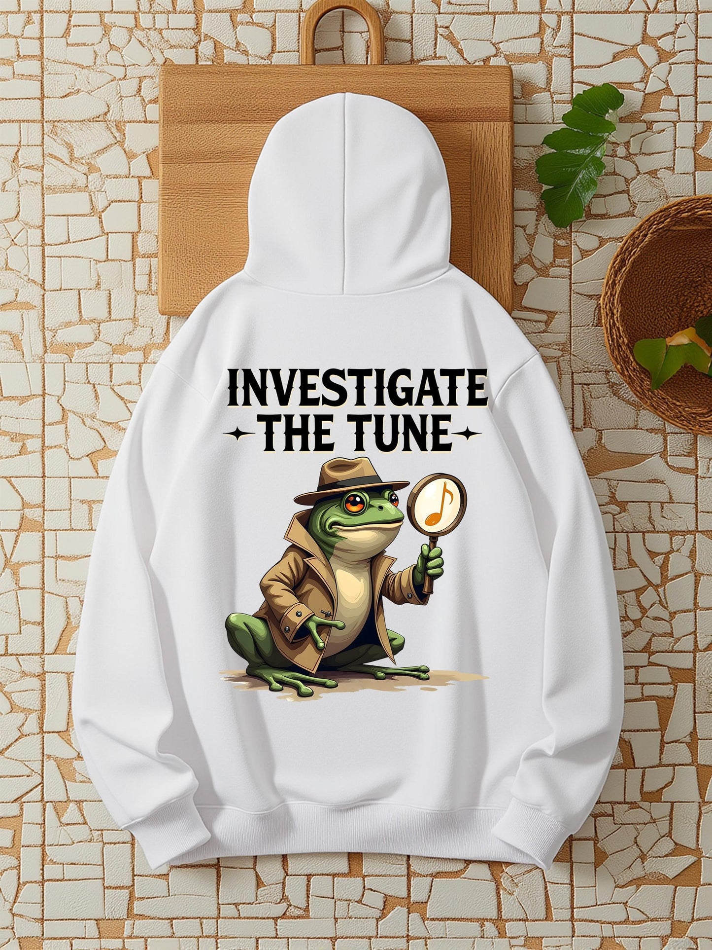 Women's Graphic Hoodie Investigate The Tune Detective Frog Holding Magnifying Glass On Music Note