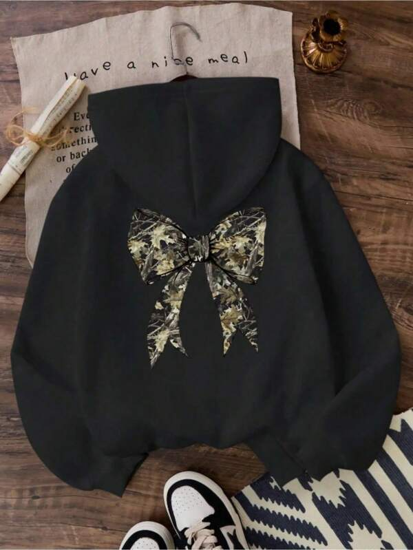 Women's Graphic Hoodie Abstract Golden Patterned Design Adorning Elegant Decorative Bow